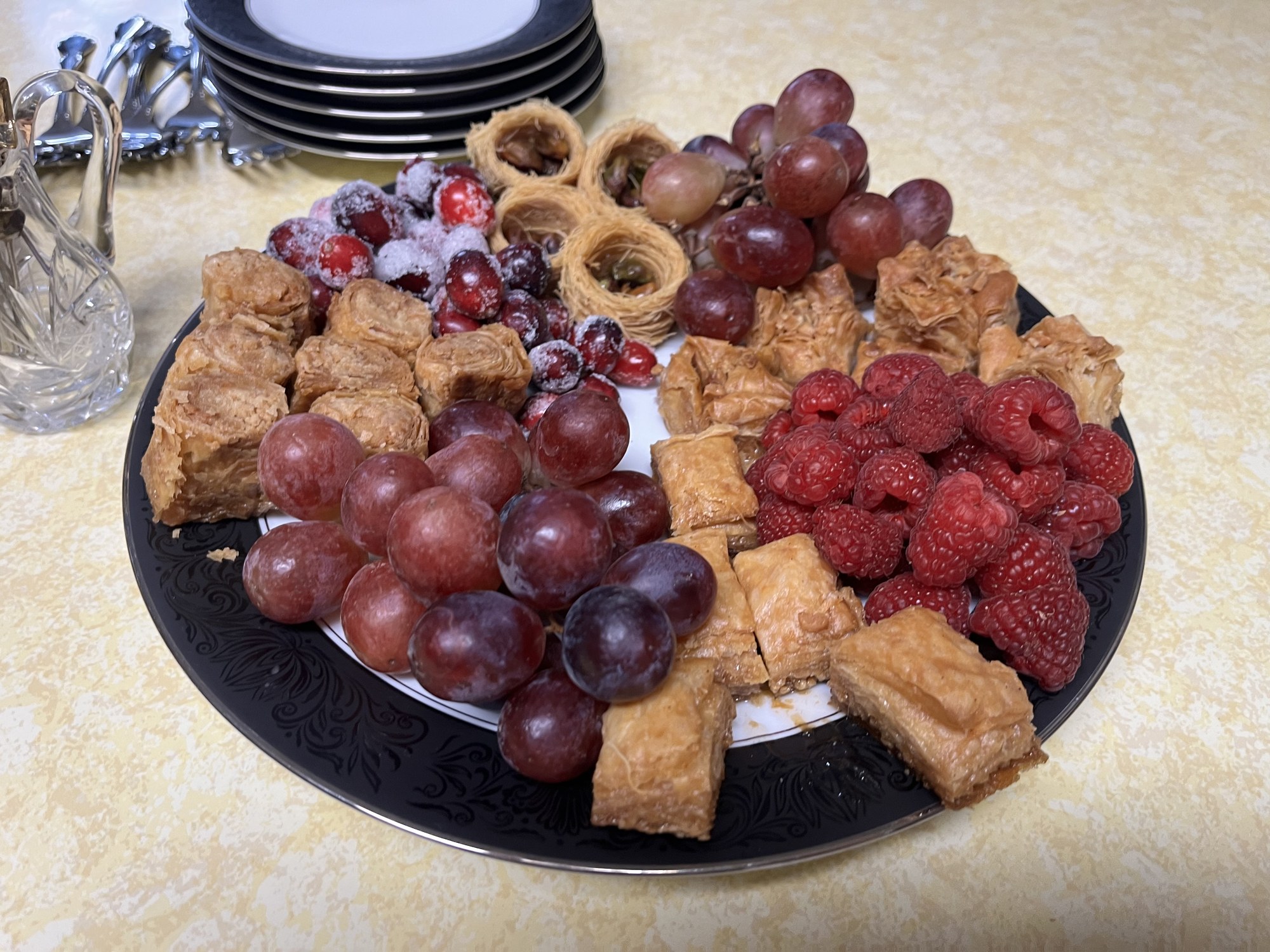 A colorful spread of fresh food including fruit, cheese, and crackers
